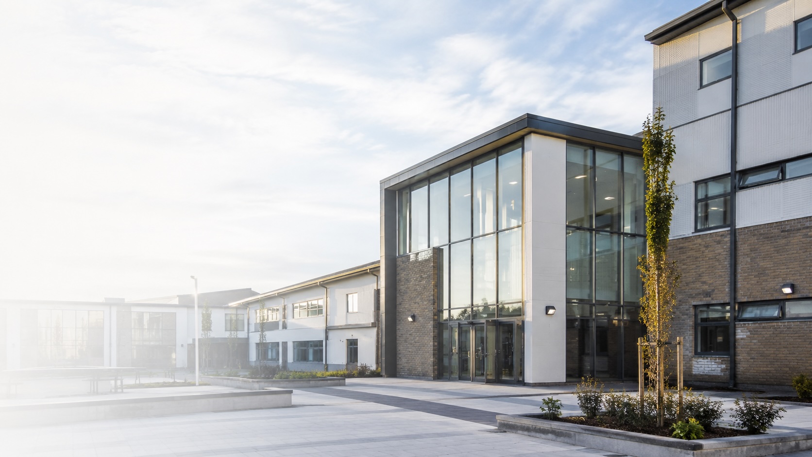 A recently completed modern school building exterior in bright daylight.